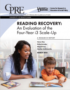 The image features the cover for Reading Recovery with a young boy reading a book while a woman supports his reading.